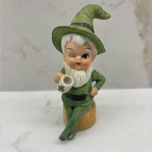 Vintage Bisque Winking Green Leprechaun Pixie Sitting on Stump St. Patrick’s Day